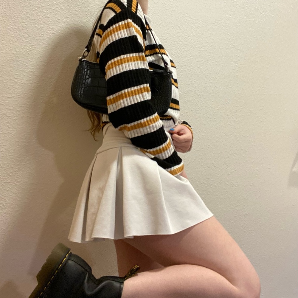yellow, black, and white sweater